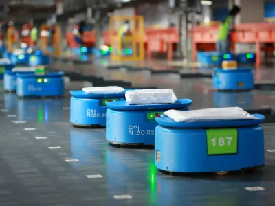 Robots operated by Alibaba's logistics unit Cainiao, move parcels at a new automated guided vehicles (AGV) warehouse inside the hub of delivery company YTO Express, in Hangzhou, Zhejiang province, China September 14, 2018. Picture taken September 14, 2018. REUTERS/Stringer ATTENTION EDITORS - THIS IMAGE WAS PROVIDED BY A THIRD PARTY. CHINA OUT.