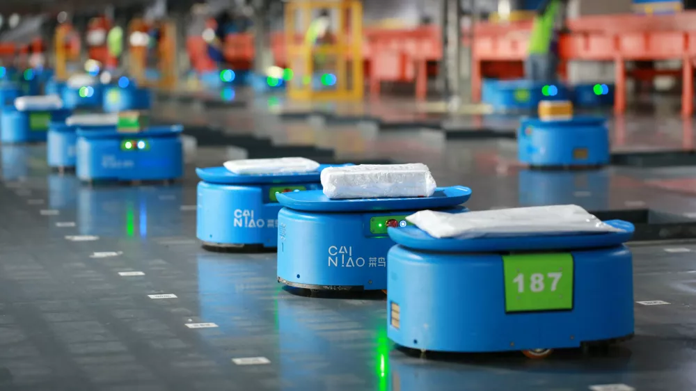 Robots operated by Alibaba's logistics unit Cainiao, move parcels at a new automated guided vehicles (AGV) warehouse inside the hub of delivery company YTO Express, in Hangzhou, Zhejiang province, China September 14, 2018. Picture taken September 14, 2018. REUTERS/Stringer ATTENTION EDITORS - THIS IMAGE WAS PROVIDED BY A THIRD PARTY. CHINA OUT.