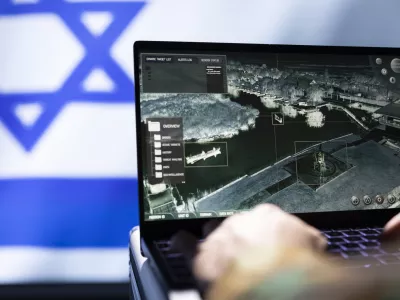 Mossad agent using laptop device, operating anti ballistic system designed to counter missiles threatening country. Close up shot of Israeli counterintelligence officer defending against rockets
