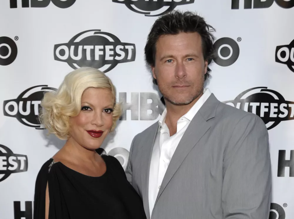 FILE - In this July 7, 2011 file photo, actress Tori Spelling, left, and actor Dean McDermott arrive at the premiere of the feature film "Gun Hill Road" in Los Angeles. (AP Photo/Dan Steinberg)