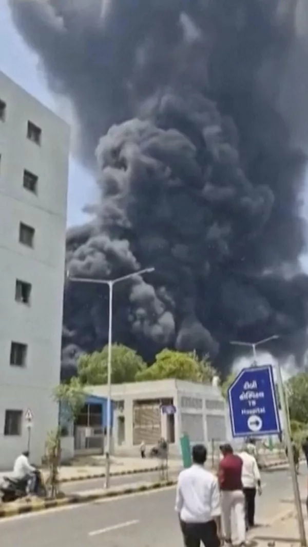 Smoke rises after an airplane crashed in Ahmedabad, Gujarat state, India, Thursday, June 12, 2025. (Mohan Nakum via AP)