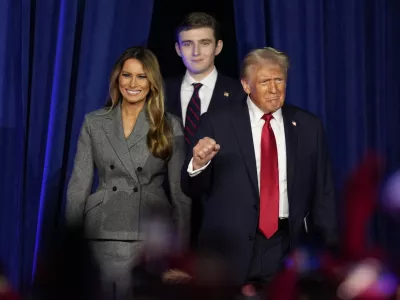 FILE - Republican presidential nominee former President Donald Trump, joined by wife Melania Trump, left, and son Barron Trump, arrives to speak at an election night watch party, Nov. 6, 2024, in West Palm Beach, Fla. (AP Photo/Alex Brandon, File)