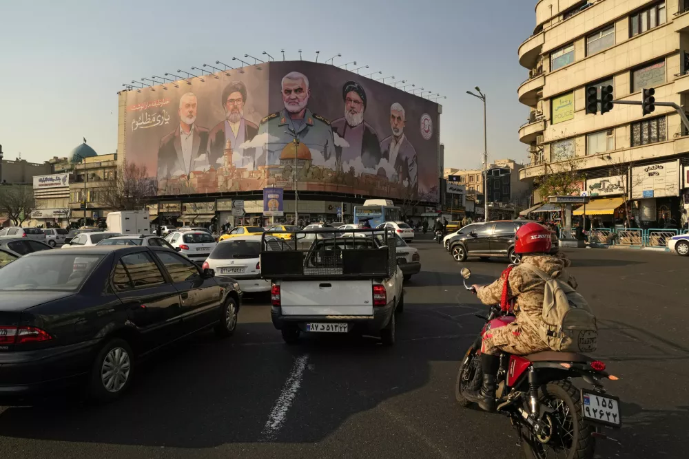 FILE - Vehicles drive on Enqelab-e-Eslami (Islamic Revolution) square in Tehran, Iran, Jan. 21, 2025. (AP Photo/Vahid Salemi, File)