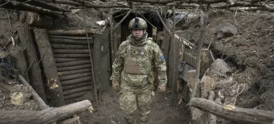FILE - A Ukrainian serviceman of the 28th Separate Mechanised Brigade stands in a trench at the front line, near Bakhmut, Donetsk region, Ukraine, March 3, 2024. (AP Photo/Efrem Lukatsky, File)