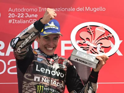 MotoGP - Italian Grand Prix - Mugello Circuit, Scarperia e San Piero, Italy - June 22, 2025 Ducati Lenovo Team's Marc Marquez celebrates on the podium with a trophy after winning the Italian Grand Prix REUTERS/Jennifer Lorenzini