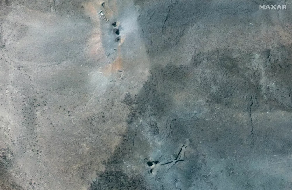 A closer satellite view shows holes and craters on a ridge at Fordow underground complex, after the U.S. struck the underground nuclear facility, near Qom, Iran June 22, 2025.   MAXAR TECHNOLOGIES/Handout via REUTERS  THIS IMAGE HAS BEEN SUPPLIED BY A THIRD PARTY. NO RESALES. NO ARCHIVES. MANDATORY CREDIT. DO NOT OBSCURE LOGO.   TPX IMAGES OF THE DAY