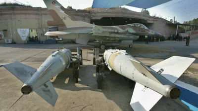 An Israeli F-16 fighter jet advances as it prepares to take off for a mission in Lebanon at Ramat David air force base in northern Israel, Thursday, July 20, 2006. Israeli warplanes launched new airstrikes on Beirut's southern suburbs, a Hezbollah stronghold, shortly after daybreak Thursday, followed by strikes in the guerrillas' heartland in the south and eastern Bekaa Valley. (AP Photo/Baz Ratner)