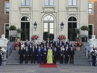 NATO heads of state and government pose for a group photo prior to a formal dinner at the Paleis Huis ten Bosch on the sidelines of the NATO summit in The Hague, Netherlands, Tuesday, June 24, 2025. (Christian Hartmann, Pool Photo via AP)