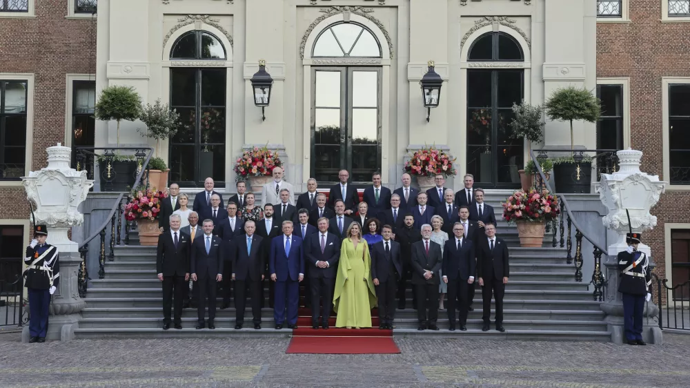 NATO heads of state and government pose for a group photo prior to a formal dinner at the Paleis Huis ten Bosch on the sidelines of the NATO summit in The Hague, Netherlands, Tuesday, June 24, 2025. (Christian Hartmann, Pool Photo via AP)