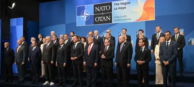 Netherlands' Prime Minister Dick Schoof, front row from fifth left, NATO Secretary General Mark Rutte, US President Donald Trump, Britain's Prime Minister Keir Starmer and Turkey's President Recep Tayyip Erdogan pose with NATO country leaders for a family photo during the NATO summit in The Hague, Netherlands, Wednesday, June 25, 2025. (Ben Stansall/Pool Photo via AP)