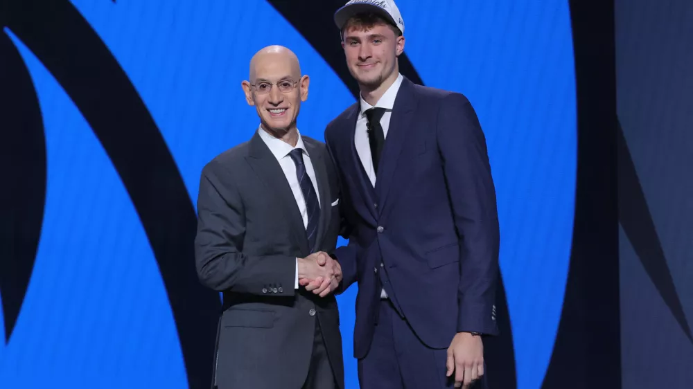 Jun 25, 2025; Brooklyn, NY, USA; Cooper Flagg poses with NBA commissioner Adam Silver after being selected as first overall by the Dallas Mavericks in the first round of the 2025 NBA Draft at Barclays Center. Mandatory Credit: Brad Penner-Imagn Images