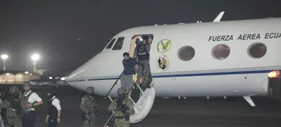 Escorted by soldiers and policemen, Adolfo "Fito" Macias, the leader of the Choneros gang, arrives in Guayaquil, Ecuador, Wednesday, June 25, 2025. (AP Photo/Joffre Flores)
