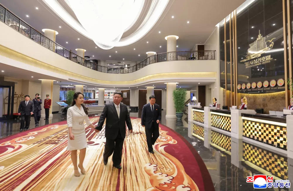 North Korean leader Kim Jong Un and his daughter Kim Ju Ae walk inside a hotel during a ceremony to celebrate the completion of the Wonsan Kalma Coastal Tourist Zone, in Wonsan, in North Korea, June 24, 2025. KCNA via REUTERS  ATTENTION EDITORS - THIS IMAGE WAS PROVIDED BY A THIRD PARTY. REUTERS IS UNABLE TO INDEPENDENTLY VERIFY THIS IMAGE. NO THIRD PARTY SALES. SOUTH KOREA OUT. NO COMMERCIAL OR EDITORIAL SALES IN SOUTH KOREA.