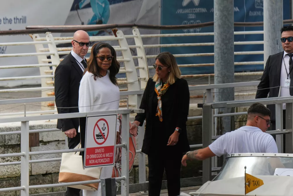 Oprah Winfrey, second left, arrives for the weekend wedding of Amazon founder Jeff Bezos and Lauren Sanchez, in Venice, Italy, Thursday, June 26, 2025. (AP Photo/Luca Bruno)