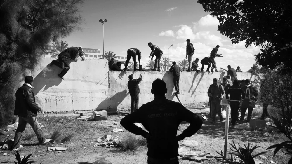 Tunisian, Egyptian and other nationals flee Libya during fighting between rebels and pro Qaddafi forces and arrive at the border crossing in Ras Jdir near Ben Gardenne, Tunisia. 2011