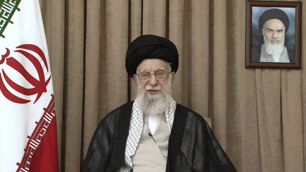 In this photo released on Thursday, June 26, 2025, by the official website of the office of the Iranian supreme leader, Supreme Leader Ayatollah Ali Khamenei speaks in a televised speech, under a portrait of the late revolutionary founder Ayatollah Khomeini. (Office of the Iranian Supreme Leader via AP)