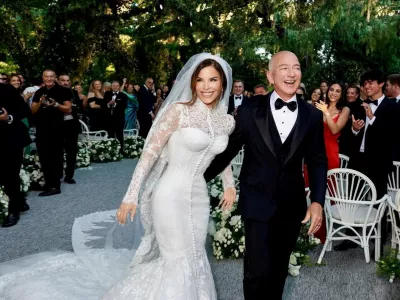 Amazon Founder Jeff Bezos and Media Personality Lauren Sanchez Bezos react on the day of their wedding in Venice, Italy, June 27, 2025 in this picture obtained from social media. @laurensanchezbezos via Instagram/via REUTERS THIS IMAGE HAS BEEN SUPPLIED BY A THIRD PARTY. MANDATORY CREDIT. NO RESALES. NO ARCHIVES.   TPX IMAGES OF THE DAY