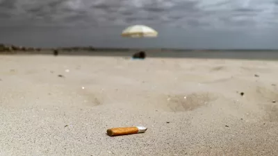 A discarded cigarette butt lies on the sand of La Baule beach on the Atlantic coast, as a nationwide ban on smoking is due to come into effect on July 1, at beaches, parks and outside schools to protect children, France, June 25, 2025. REUTERS/Stephane Mahe