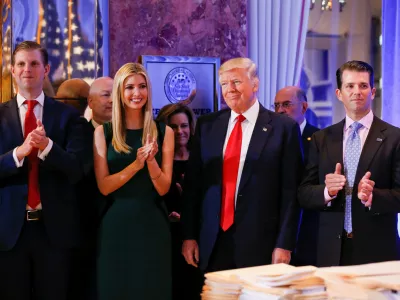 U.S. President-elect Donald Trump (C) smiles as he is applauded by his son Eric Trump (L) daughter Ivanka and son in law Jared Kushner (R) ahead of a press conference in Trump Tower, Manhattan, New York, U.S., January 11, 2017. REUTERS/Shannon Stapleton
