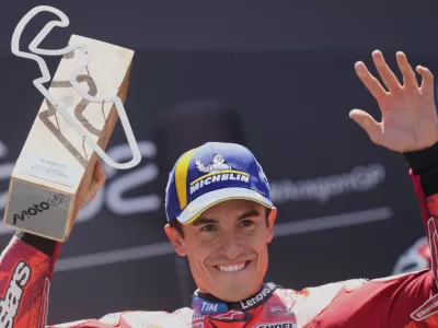 Race winner Spain's rider Marc Marquez of the Ducati Lenovo Team celebrates on the podium after the MotoGP race of the Grand Prix of Aragon at the MotorLand Aragon circuit, in Alcaniz, Spain, Sunday, June 8, 2025. (AP Photo/Jose Breton)