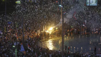 People wave their mobile phones with flashing lights during a major anti-government rally in Belgrade, Serbia, Saturday, June 28, 2025. (AP Photo/Marko Drobnjakovic)