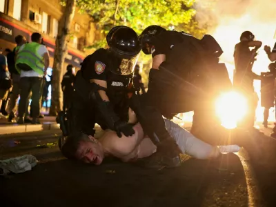 Law enforcement officers detain a demonstrator, during an anti-government protest demanding snap elections, in Belgrade, Serbia, June 28, 2025. REUTERS/Marko Djurica