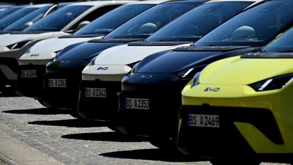 FILE PHOTO: BYD Dolphin Surf electric cars are parked infront of the venue where BYD carmaker holds a vehicle presentation event in Berlin, Germany May 21, 2025. REUTERS/Annegret Hilse/File Photo