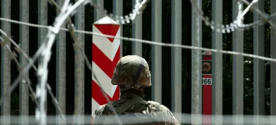 FILE PHOTO: A soldier stands guard near the fence on the Belarusian-Polish border in the forest near Bialowieza, Poland, June 4, 2024. REUTERS/Kacper Pempel/File Photo
