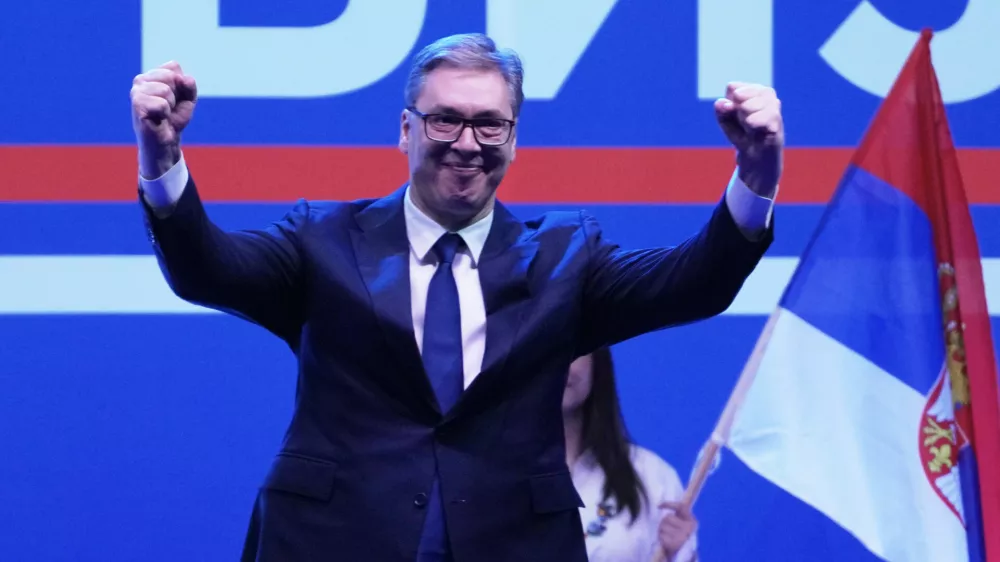 Serbia's President Aleksandar Vucic greets his supporters gathered during a huge rally in his support, apparently designed to counter student-led gatherings in Belgrade, Serbia, Saturday, April 12, 2025. (AP Photo/Darko Vojinovic)