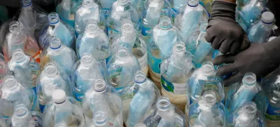 FILE PHOTO: Members of North Korean defector group Kuensaem fill empty plastic bottles with rice and masks, during preparations for an event to send the bottles towards the North, in Seoul, South Korea, June 18, 2020. REUTERS/Kim Hong-Ji/File Photo
