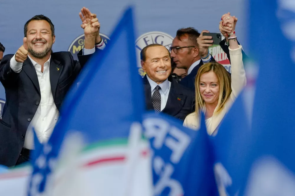 FILE - From left, The League's Matteo Salvini, Forza Italia's Silvio Berlusconi, and Brothers of Italy's Giorgia Meloni attend the final rally of the center-right coalition in central Rome, Thursday, Sept. 22, 2022. Just in time to celebrate his 86th birthday, Italy's former premier Silvio Berlusconi is making his return to Italy's parliament, winning a seat in the Senate nearly a decade after being banned from public office over a tax fraud conviction.(AP Photo/Alessandra Tarantino, File)