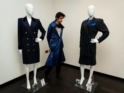 A person views a Princess Diana 1995 New York Catherine Walker Coat Dress estimated between ,000 - ,000 and a Princess Diana Three Piece Escada Suit estimated between ,000 - ,000 on display at the preview of Princess Diana's Style & Royal Collection, the largest collection of Diana, Princess of Wales' fashion to appear at auction. Over 200 items of Princess Diana's wardrobe feature alongside pieces owned by the Duke and Duchess of Windsor, Queen Elizabeth II and the Queen Mother in the private exhibition at the Peninsula London, before heading to the Peninsula Beverly Hills where the items will be sold by Julien's Auctions on June 26. Picture date: Tuesday June 3, 2025.,Image: 1006694435, License: Rights-managed, Restrictions:, Model Release: no