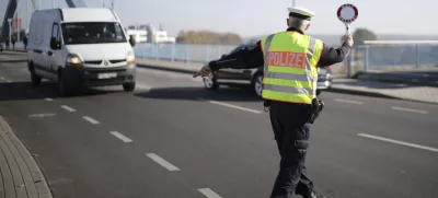 FILE - A officer of German Federal Police stops a van to search for immigrants at the border crossing from Poland into Germany in Frankfurt an der Oder, Germany, Oct. 28, 2021. Germany will increase its police patrols along "smuggling routes" on the border with Poland the Czech Republic in an effort to prevent more migrants from entering the country, it was announced Wednesday, Sept. 27, 2023. (AP Photo/Markus Schreiber, File)