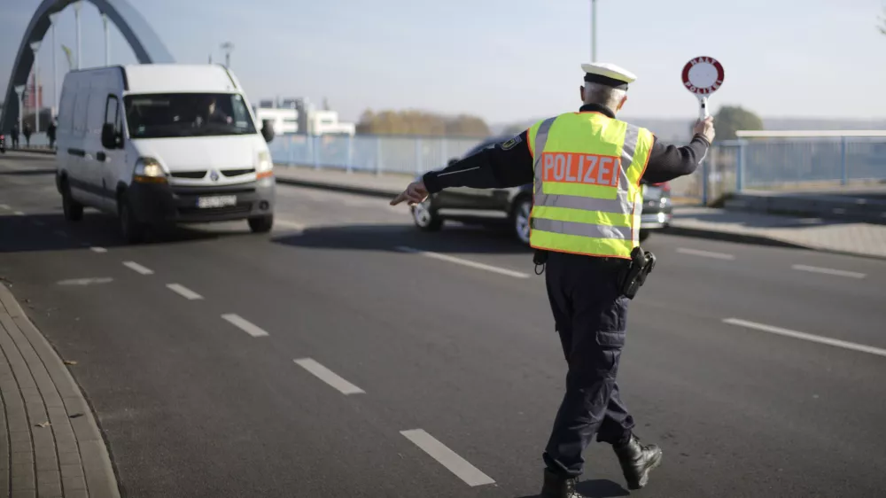 FILE - A officer of German Federal Police stops a van to search for immigrants at the border crossing from Poland into Germany in Frankfurt an der Oder, Germany, Oct. 28, 2021. Germany will increase its police patrols along "smuggling routes" on the border with Poland the Czech Republic in an effort to prevent more migrants from entering the country, it was announced Wednesday, Sept. 27, 2023. (AP Photo/Markus Schreiber, File)
