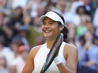 Emma Raducanu of Britain celebrates winning the second round women's singles match against Marketa Vondrousova of the Czech Republic at the Wimbledon Tennis Championships in London, Wednesday, July 2, 2025.(AP Photo/Kirsty Wigglesworth)