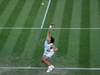 Tennis - Wimbledon - All England Lawn Tennis and Croquet Club, London, Britain - July 3, 2025 Ben Shelton of the U.S. in action during his second round match against Australia's Rinky Hijikata REUTERS/Toby Melville