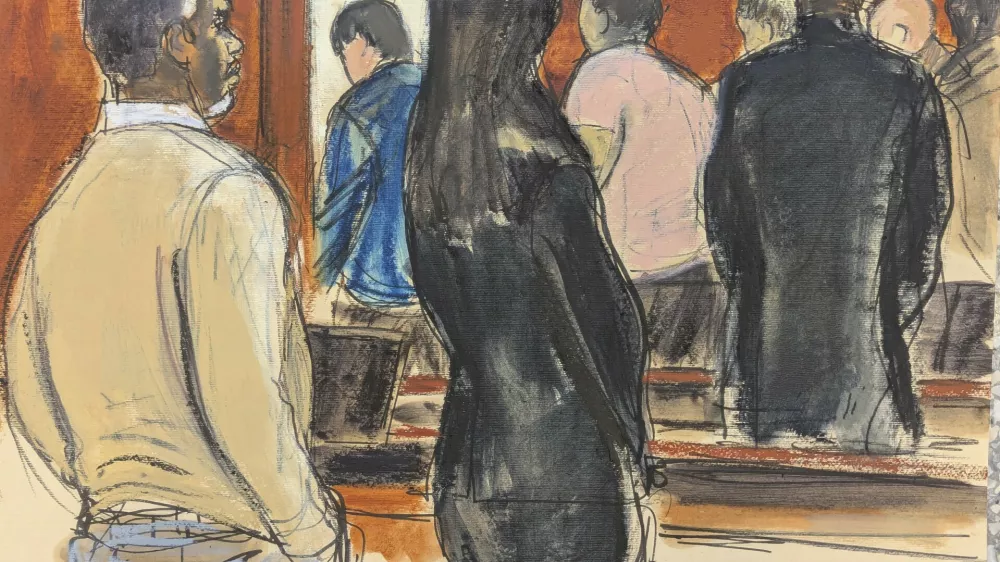 Sean 'Diddy' Combs, left, stands with his defense team, as he watches the jury file out after Judge Arun Subramanian instructed the jury to continue deliberations in Manhattan federal court, Tuesday, July 1, 2025, in New York. (Elizabeth Williams via AP)