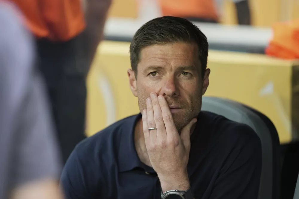 Real Madrid manager Xabi Alonso sits before the Club World Cup round of 16 soccer match between Real Madrid and Juventus in Miami Gardens, Fla., Tuesday, July 1, 2025. (AP Photo/Rebecca Blackwell)