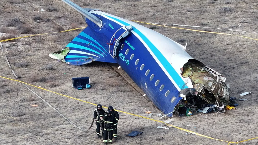 FILE PHOTO: A drone view shows emergency specialists working at the crash site of an Azerbaijan Airlines passenger plane near the city of Aktau, Kazakhstan December 25, 2024. REUTERS/Azamat Sarsenbayev/File Photo