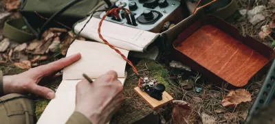 Russian Soviet Infantry Red Army Soldier In World War II using Russian Soviet Portable Radio Transceiver In Trench Entrenchment In Spring Autumn Forest.. Headphones And Telegraph Key. Close Up Hands, / Foto: Bruev