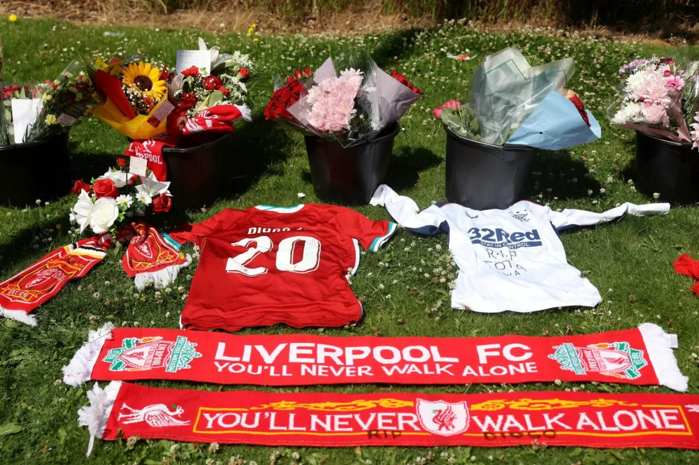 Flowers and tributes are left outside Liverpool's Anfield Stadium after Liverpool's Portuguese soccer player Diogo Jota died in a car crash near Zamora, Spain, in Liverpool, Britain, July 3, 2025. REUTERS/Temilade Adelaja   TPX IMAGES OF THE DAY