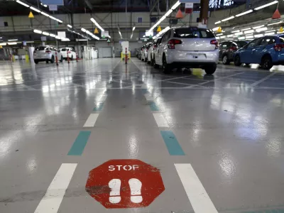 FILE - This Jan.28 2013 file photo, shoiws the French car manufacturer PSA Peugeot Citroen assembly line in Aulnay-sous-Bois, north of Paris. The maker of Peugeot and Citroen cars hopes to lay off 1,300 people this year and hire another 1,300 under new labor rules championed by President Emmanuel Macron to give companies more flexibility to hire and fire. PSA is among the first big companies to apply the new rules, which came into effect this month(AP Photo/Christophe Ena, File)