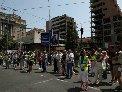 University students and other people stand in silence to commemorate the 16 victims, who were killed after a railway concrete canopy fell in November 2024 in Novi Sad, during a protest against government pressure on the universities, in front of a government building, in Belgrade, Serbia, June 9, 2025. REUTERS/Zorana Jevtic