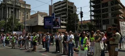 University students and other people stand in silence to commemorate the 16 victims, who were killed after a railway concrete canopy fell in November 2024 in Novi Sad, during a protest against government pressure on the universities, in front of a government building, in Belgrade, Serbia, June 9, 2025. REUTERS/Zorana Jevtic