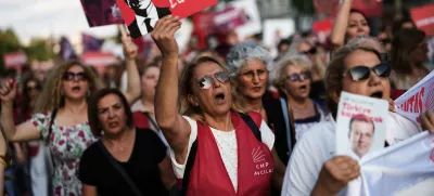 Women shout slogans during a protest called by the main opposition Republican People's Party or (CHP), outside the City Hall in Istanbul, Turkey, Tuesday, July 1, 2025. (AP Photo/Francisco Seco)