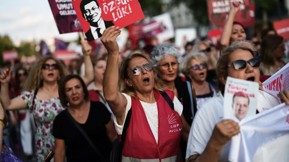 Women shout slogans during a protest called by the main opposition Republican People's Party or (CHP), outside the City Hall in Istanbul, Turkey, Tuesday, July 1, 2025. (AP Photo/Francisco Seco)