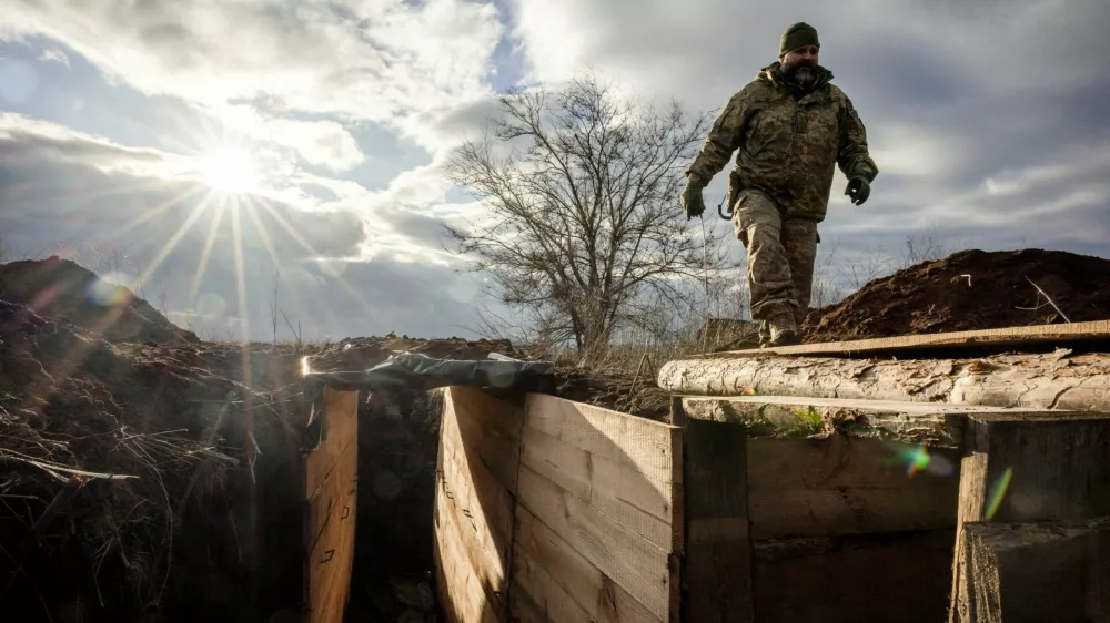 FILE PHOTO: Ukrainian military engineer with the callsign Lynx inspects a freshly dug trench that his unit built as part of a system of new fortifications near the front lines outside Kupiansk, amid Russia's attack on Ukraine, December 28, 2023. REUTERS/Thomas Peter/File Photo