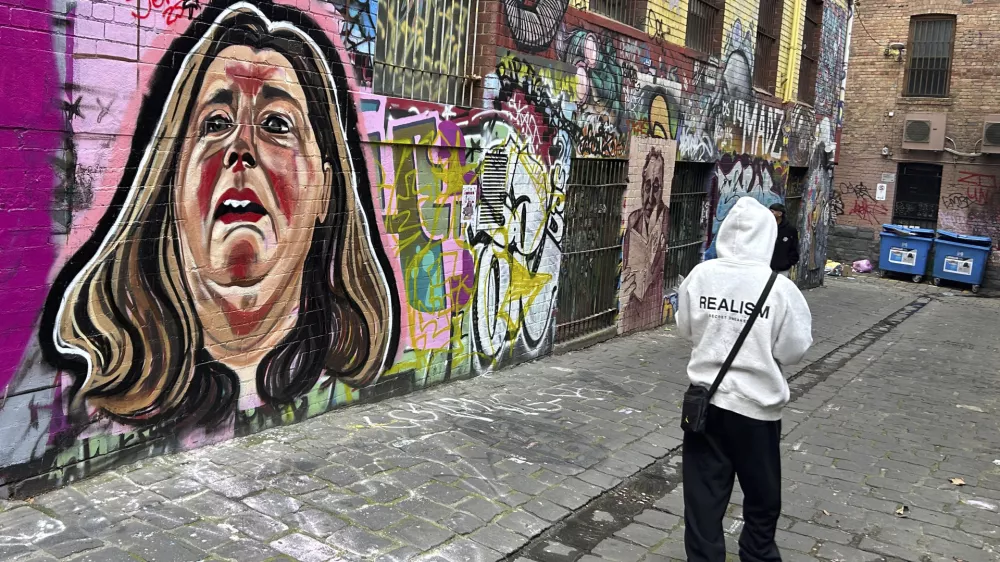 A likeness of Erin Patterson is painted on a wall in Melbourne, Australia, on June 28, 2025. (AP Photo/Rod McGuirk)