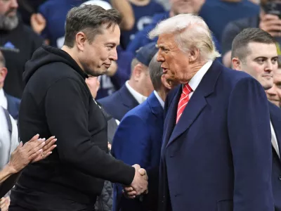 FILE PHOTO: Mar 22, 2025; Philadelphia, PA, USA; Elon Musk and President Donald Trump during the Division I Men's Wrestling Championship held at Wells Fargo Center. Mandatory Credit: Eric Hartline-Imagn Images/File Photo