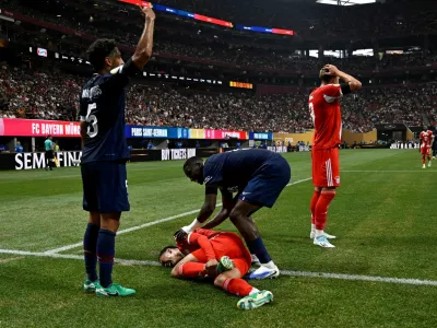 FILE PHOTO: Soccer Football - FIFA Club World Cup - Quarter Final - Paris St Germain v Bayern Munich - Mercedes-Benz Stadium, Atlanta, Georgia, U.S. - July 5, 2025 Bayern Munich's Jamal Musiala sustains an injury after a collision with Paris St Germain's Gianluigi Donnarumma REUTERS/Pablo Morano/File Photo